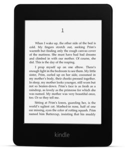 Kindle Paperwhite with e-ink screen displaying a book