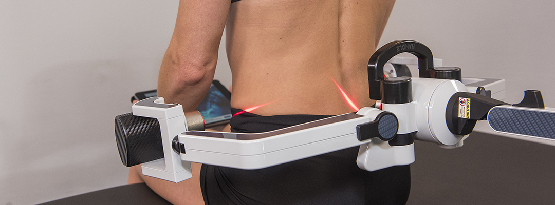 Erchonia’s FX-635 Laser treating woman’s lower back pain.