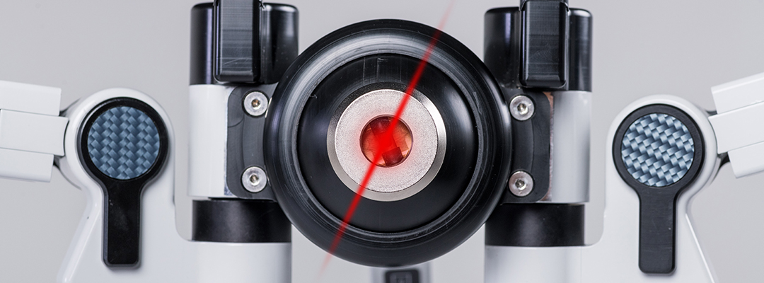 Close-up of advanced laser therapy device with red light emission