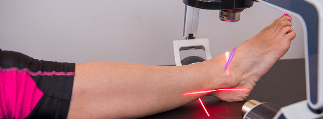 Erchonia FX-405 Low Level laser treating a woman’s ankle.