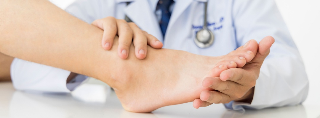 Podiatrist examining foot