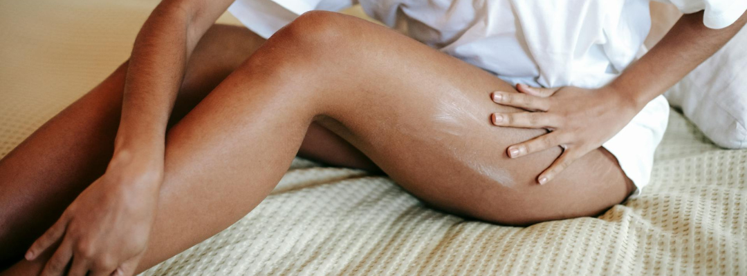 Woman Massaging Legs to Reduce Cellulite