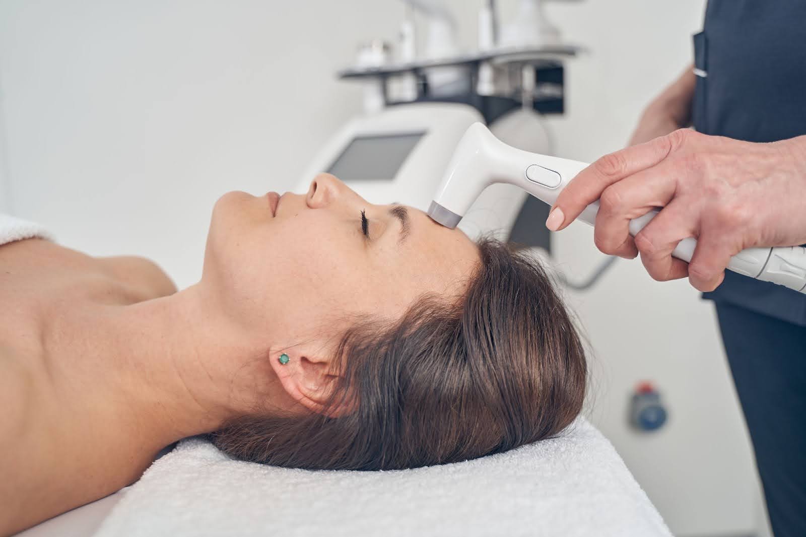 Low-level laser therapy applied to a young woman to support her pain management, recovery, and mobility