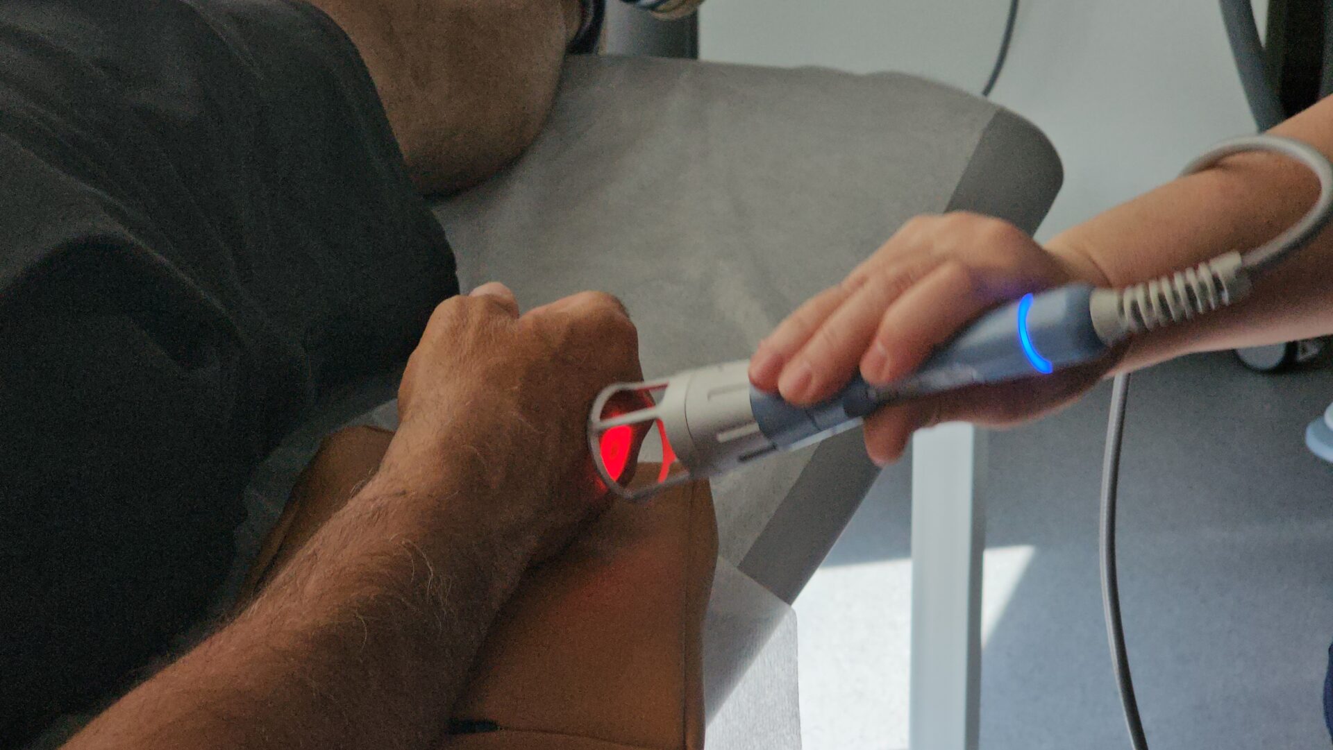 laser treatment session at a clinic showing patient receiving wound care