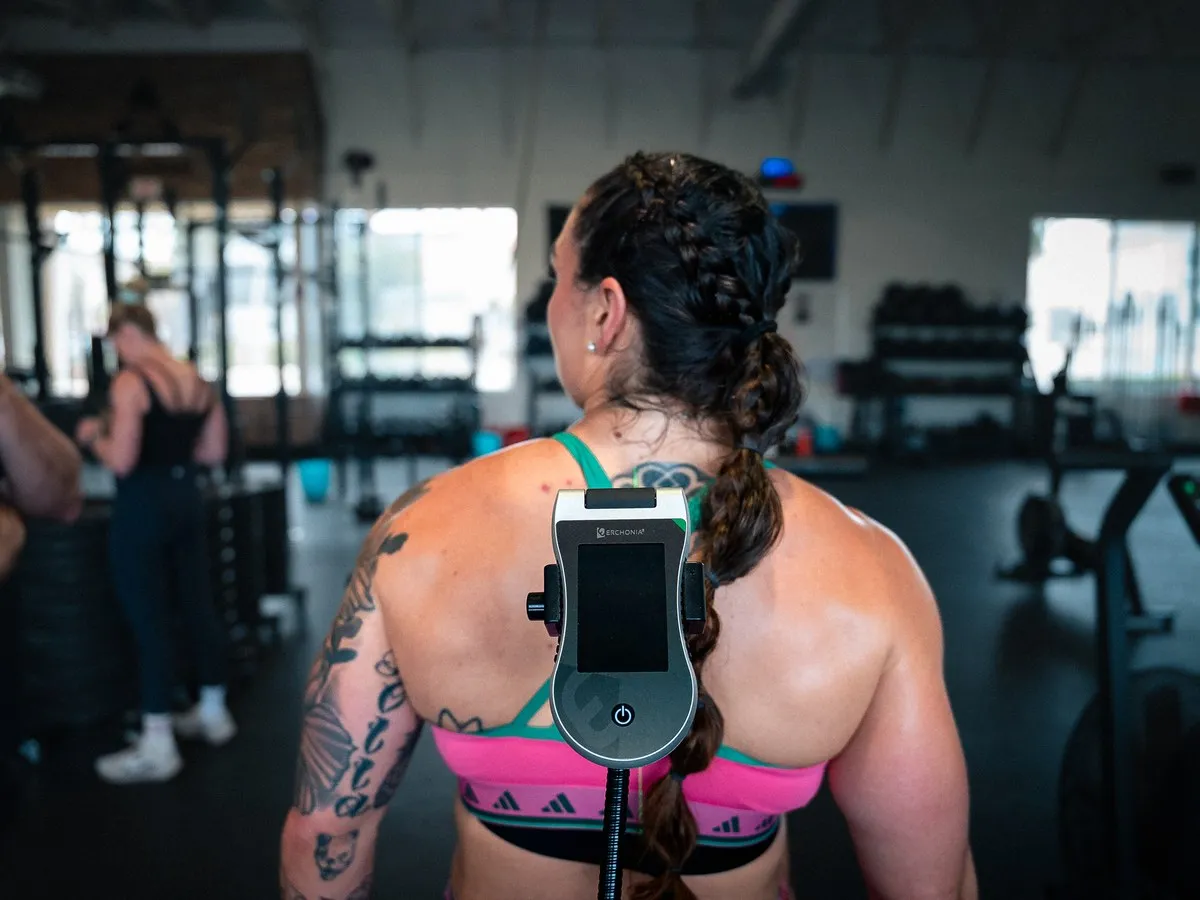 An athlete treated with a GVL laser in a training facility